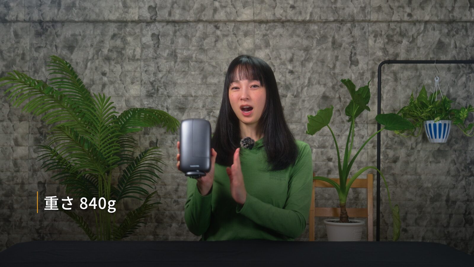 Yoshimi Iwasaki holding the DWARF mini smart telescope