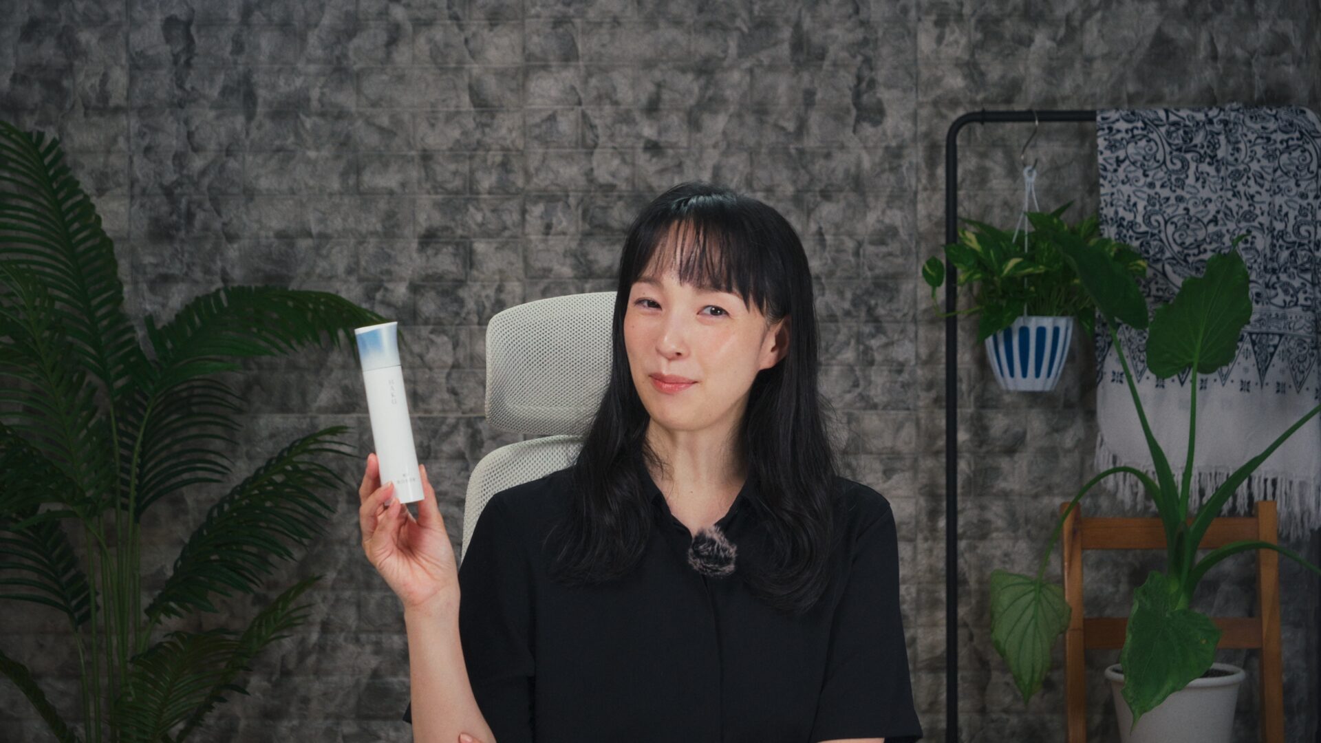 Yoshimi Iwasaki holding a serum bottle