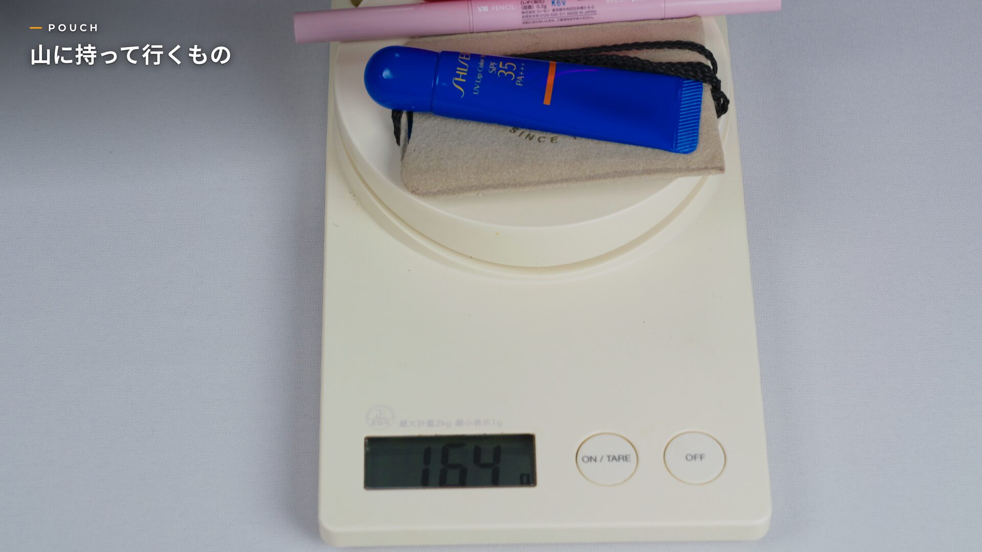 Kitchen scale showing 164g with the pouch contents